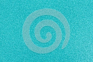 Bright teal glitter textured paper background