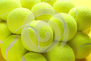 Bright tennis balls, closeup view. Sports equipment