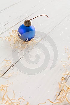 bright toys for Christmas tree and interior design, on white wooden background