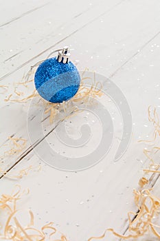 bright toys for Christmas tree and interior design, on white wooden background
