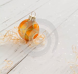 bright toys for Christmas tree and interior design, on white wooden background