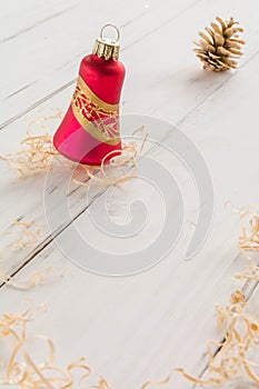 bright toys for Christmas tree and interior design, on white wooden background