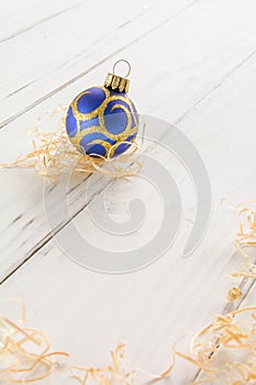 bright toys for Christmas tree and interior design, on white wooden background