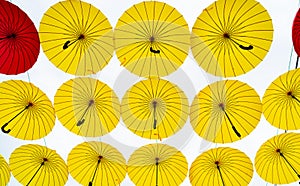 Bright umbrellas hanging sky background