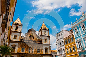 Bright view of Pelourinho in Salvador, Brazil, dominated by the large colonial Cruzeiro de Sao Francisco Christian stone cross in photo