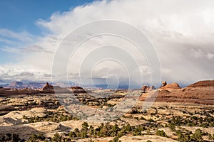 Bright White Clouds Begin To Engulf The Needles District Of Canyonlands