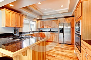 Bright wood kitchen with coffered ceiling