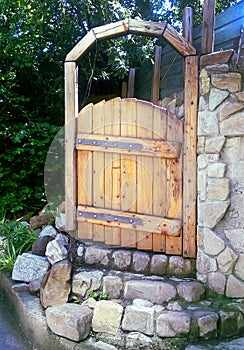 Bright wooden door in white stone wall