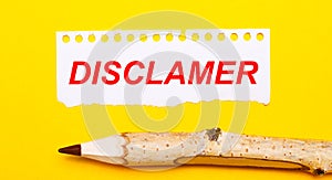 On a bright yellow background, a large wooden pencil and a sheet of torn paper with the text DISCLAIMER