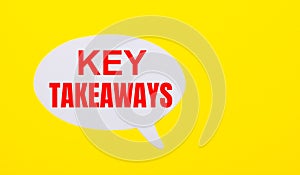 On a bright yellow background, white paper with the words KEY TAKEAWAYS