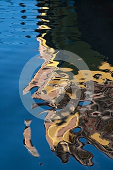 Building reflected in the water of the canal