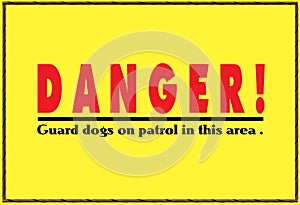 A bright yellow danger sign warning about dogs on patrol. The fonts are red and black in color.