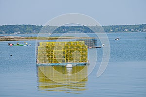 Bright Yellow lobster cages sit on a loading platform in Wills G