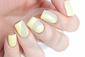Bright yellow manicure with black stripes and sunflowers pattern on white background