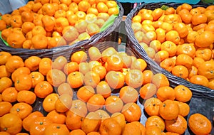Bright yellow oranges on fruit baskets are high in vitamin C, nourishing health. Prevents cancer, slows down aging