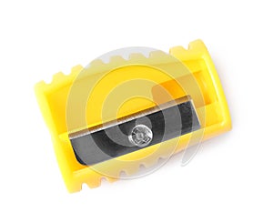 Bright yellow pencil sharpener isolated on white, top view. School stationery