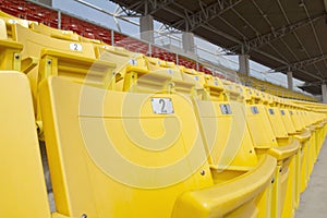 Bright yellow and red stadium seats on the stadium