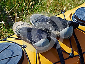 Bright yellow sea kayak on the beach