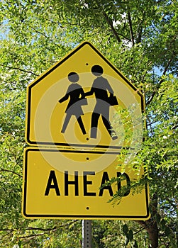 Bright yellow sign for pedestrian crossing