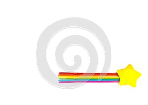 A bright yellow star and seven tubes of rainbow colors lie on a white background. Objects depict a comet. The colors