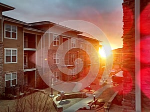 Bright sun beaming through apartment complex