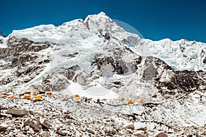 Bright yellow tents in Mount Everest Base Camp, Khumbu glacier and mountains, Nepal, Himalayas