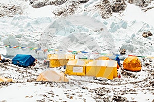 Bright yellow tents in Mount Everest Base Camp, Khumbu glacier and mountains, Nepal, Himalayas