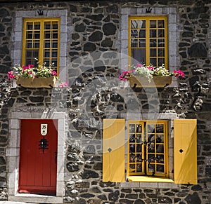Bright Yellow windows and a red door