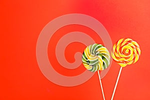 Bright yummy candies on color background.