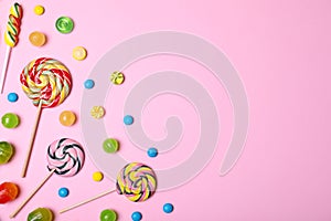 Bright yummy candies and space for text on color background