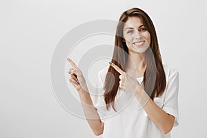 Brighten this copy space. Portrait of good-looking ordinary european woman with brown hair smiling cheerfully and