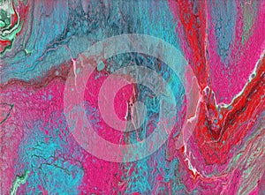 Brightly colored abstract blue and pink marbled background photo