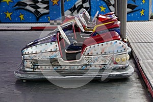 Brightly-colored array of small cars on a carnival ride