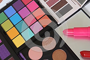 Brightly Colored Cosmetic Pigment Palettes With Various Cosmetics