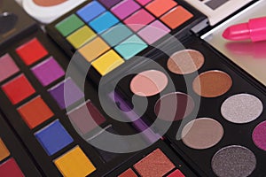 Brightly Colored Cosmetic Pigment Palettes With Various Cosmetics