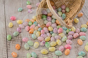 Brightly colored Easter Egg Candy spilling from wicker basket