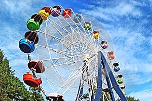 Brightly colored Ferris wheel against the sky