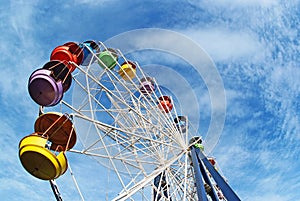 Brightly colored Ferris wheel against the sky