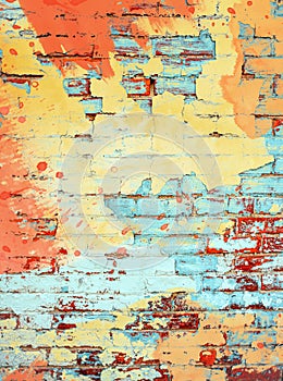 Orange yellow and aqua turquoise paint splatter on brick wall background texture template