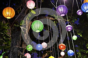 A brightly colored paper lantern hung unde