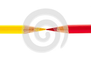 Brightly colored red and yellow pencils isolated