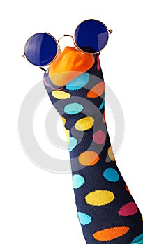Brightly colored sock puppet with polk dots