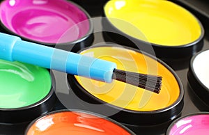 Brightly Coloured Paint and Pencils