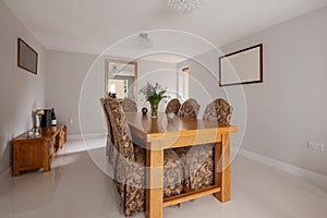 Brightly decorated dining room with tiled floor