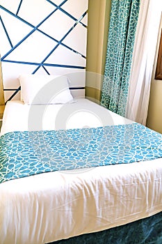 Brightly and fresh classic bedroom suite, Hotel room with modern interior, white bedding, pillows, luxury lamp style