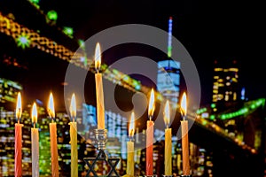 Brightly Glowing Hanukkah Menorah Shallow Depth of Field Brooklyn Bridge over night