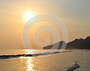 Brightly Illuminated Golden Sun with Reflection in Sea Water in Evening at Radhanagar Beach, Havelock Island, Andaman, India
