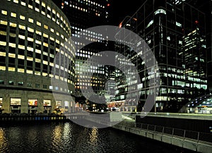 The Brightly Lit Bank Towers At Reuters Plaza In Canary Wharf London England At Night