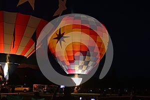 Brightly lit hot air balloons night burn Boise Idaho 2019