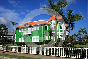 Brightly painted green clapboard building